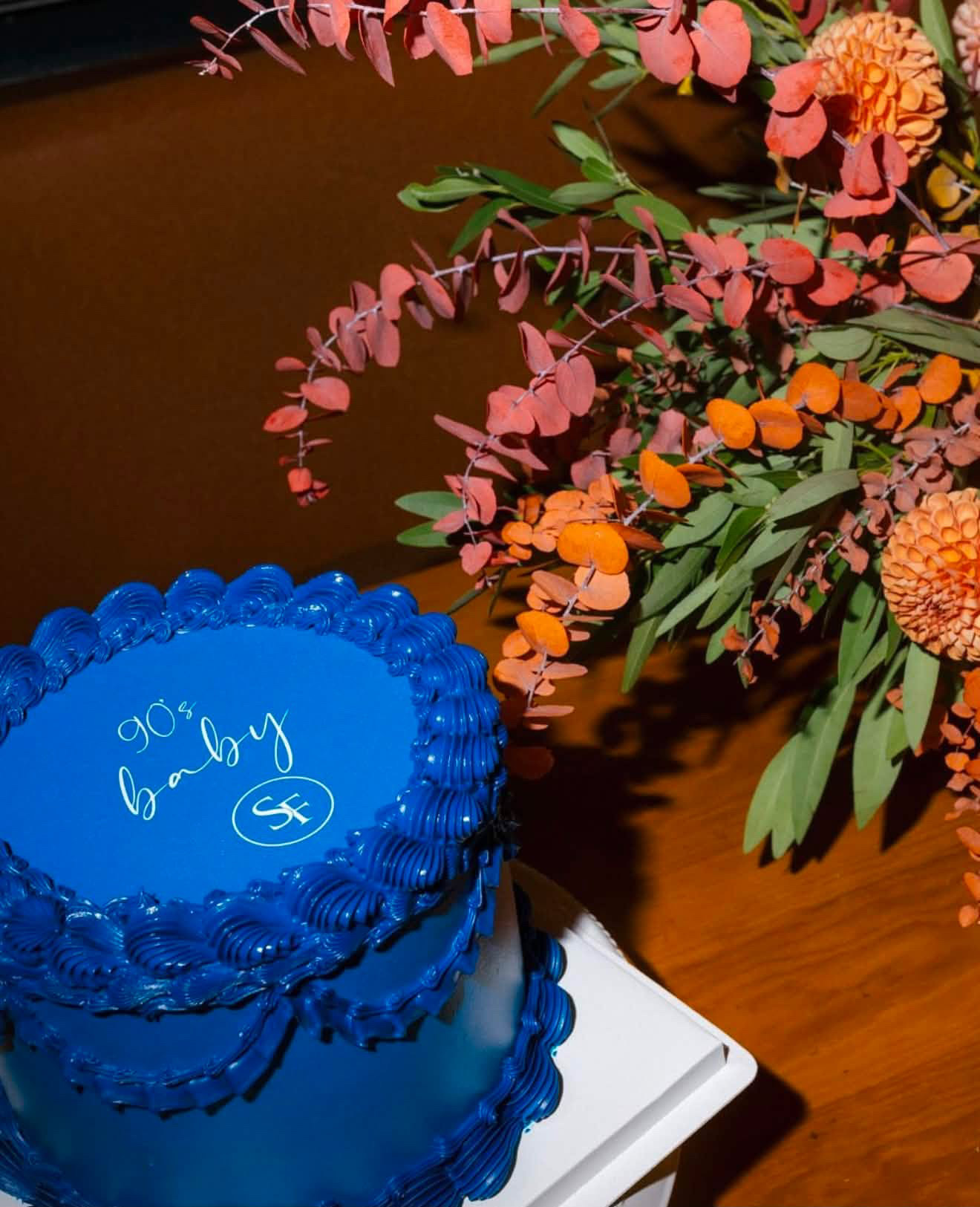 Custom blue branded birthday cake for corporate event