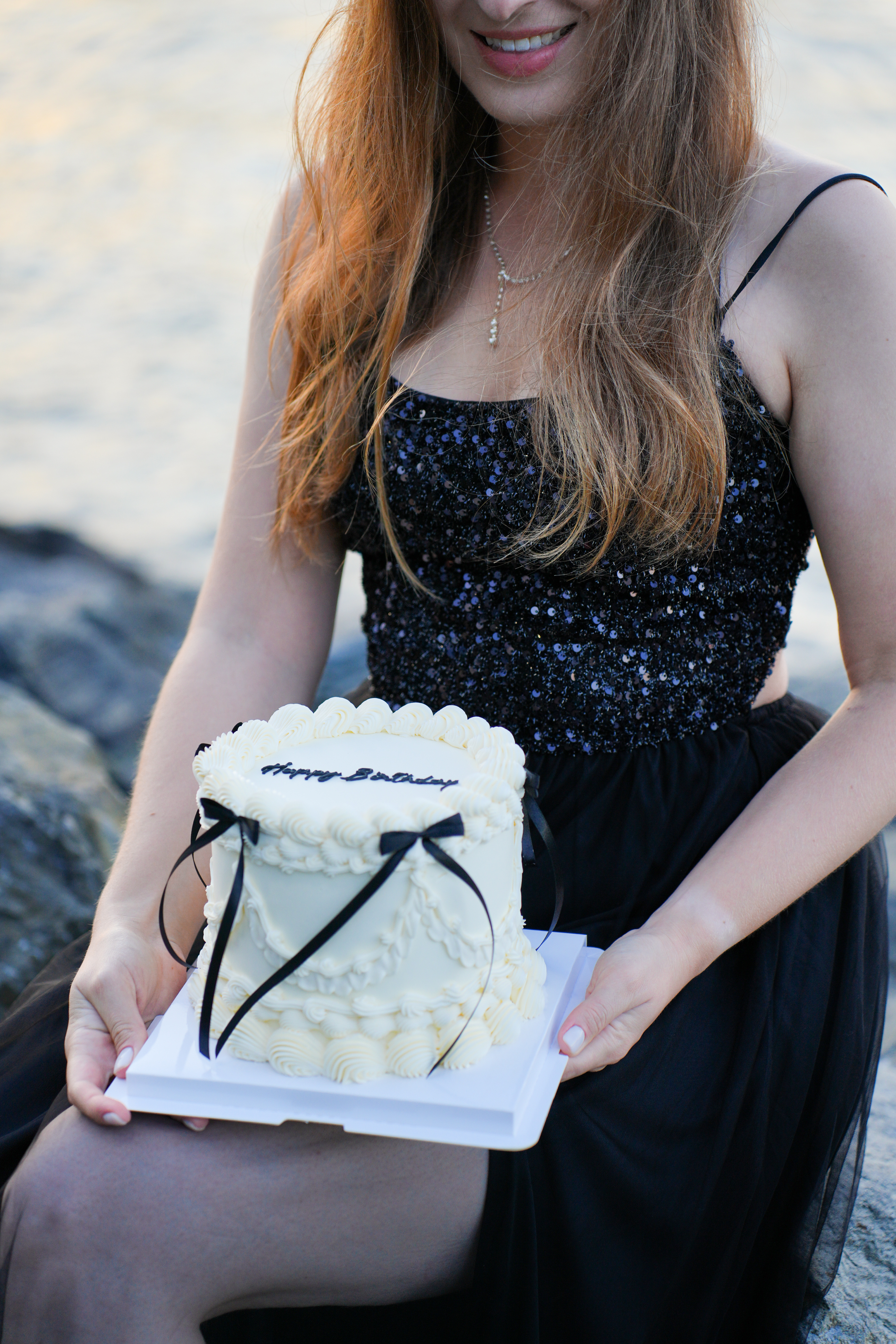Custom vintage cake held at golden hour